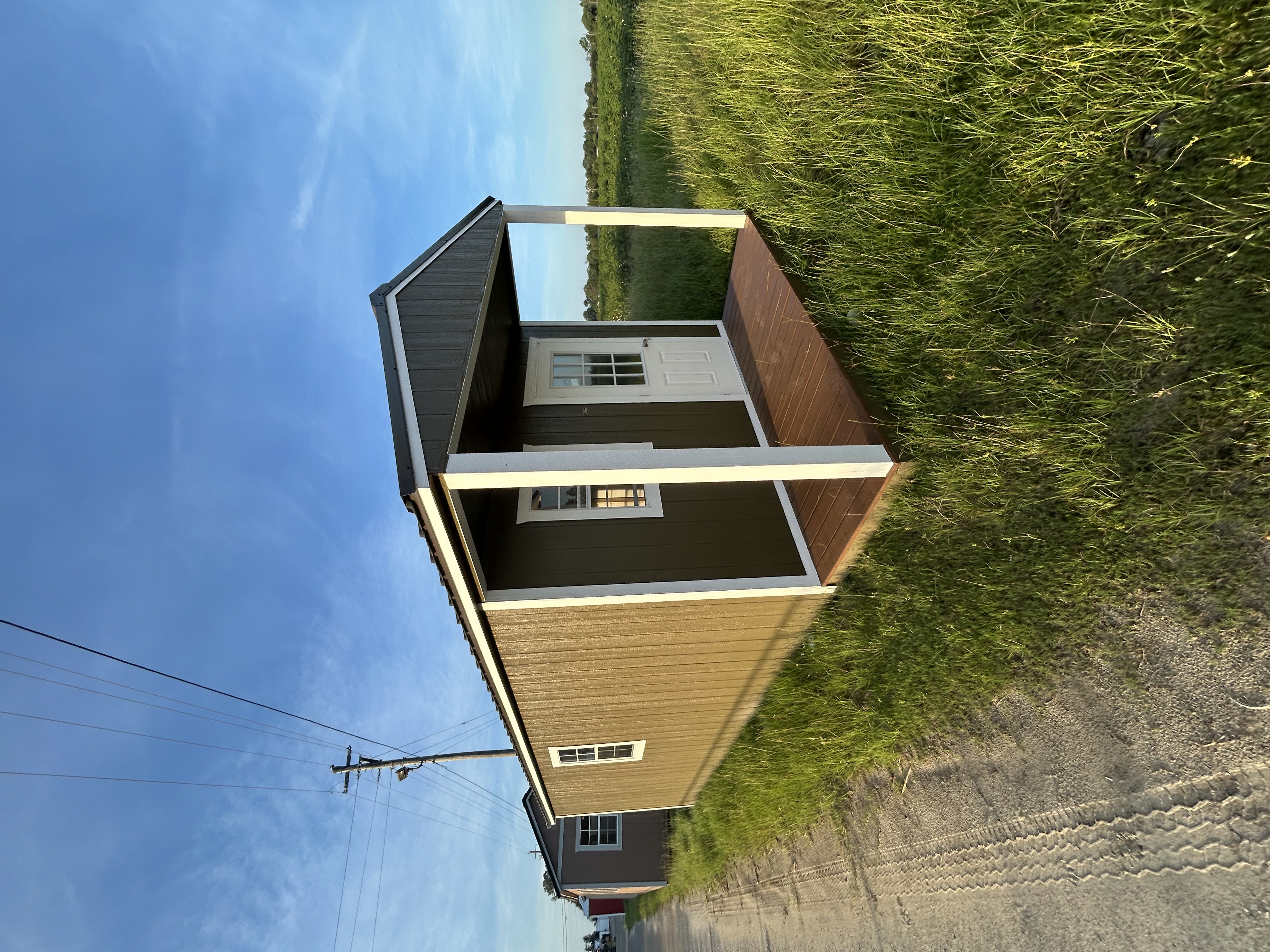 Economy Porch - tan and dark green exterior with covered porch